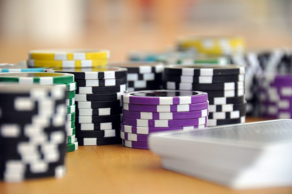 https://dlaignite.com/wp-content/uploads/2019/11/blue-green-and-purple-poker-chips-39856-scaled-e1573732385593.jpg